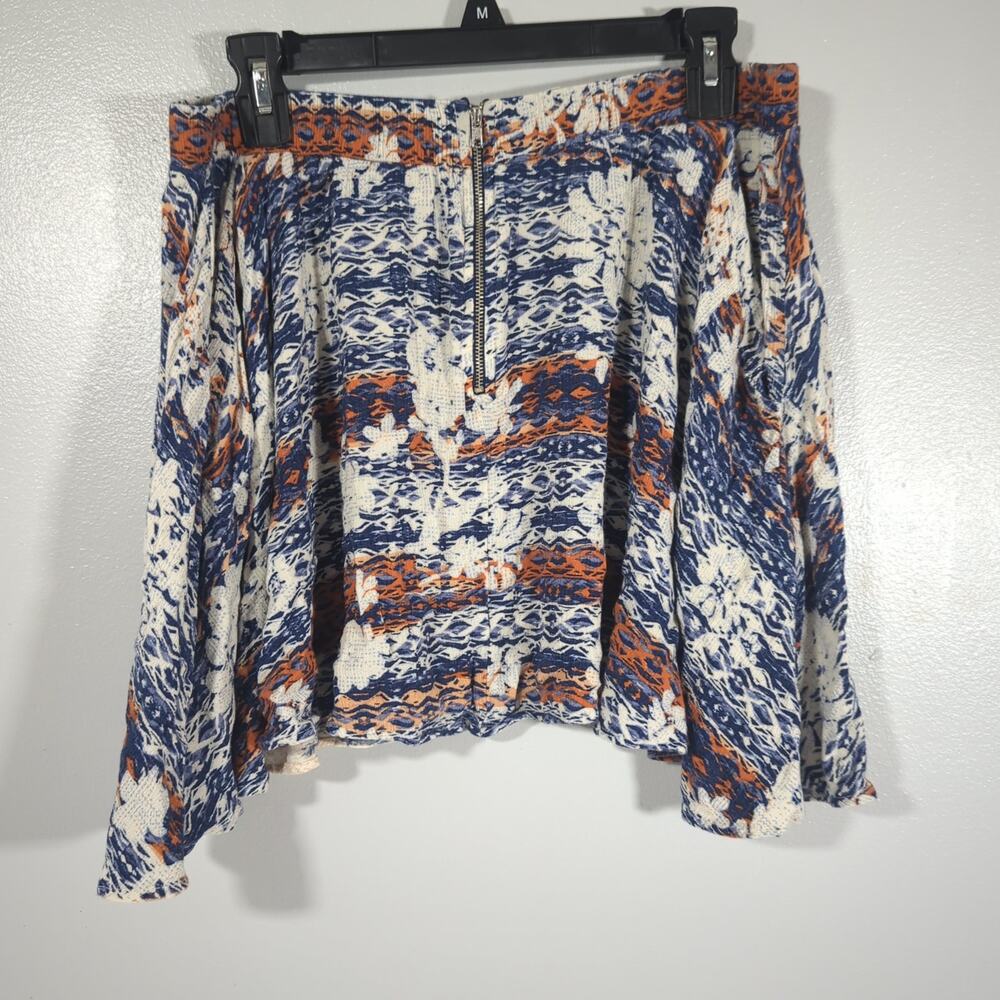Size XL Lily White boho-chic Mini skirt featuring abstract florals and flowy hem